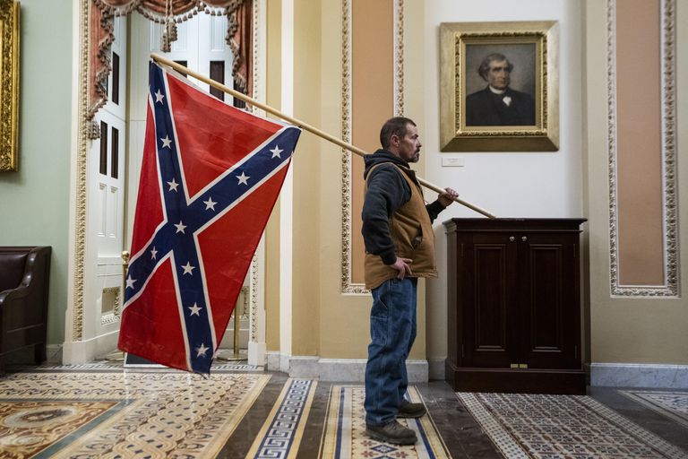The man with the Confederacy flag, on January 6, at the Capitol.