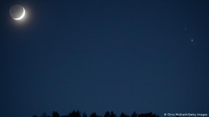 Jupiter (lower right) and Saturn (upper right).  On the left is the moon. 