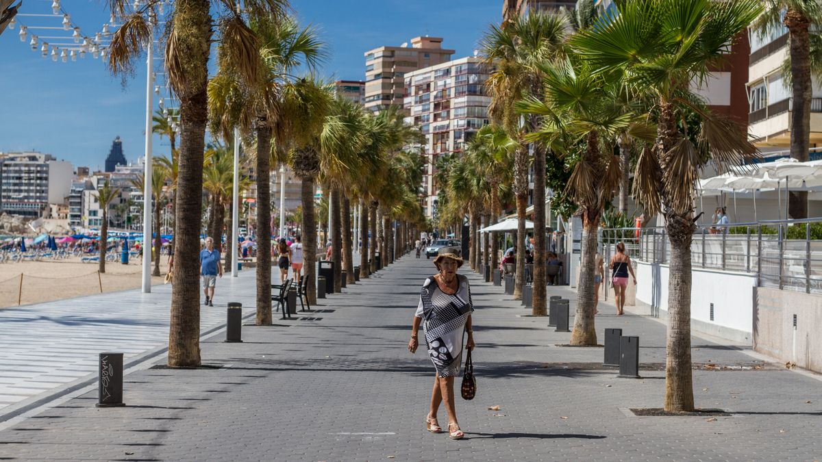 Archive - A woman walks along the Benidorm promenade during World Tourism Day 2020