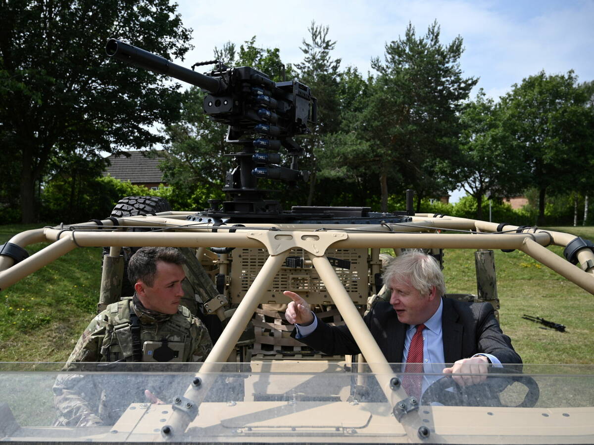 Photo: Johnson driving an armored vehicle.  (Reuters)