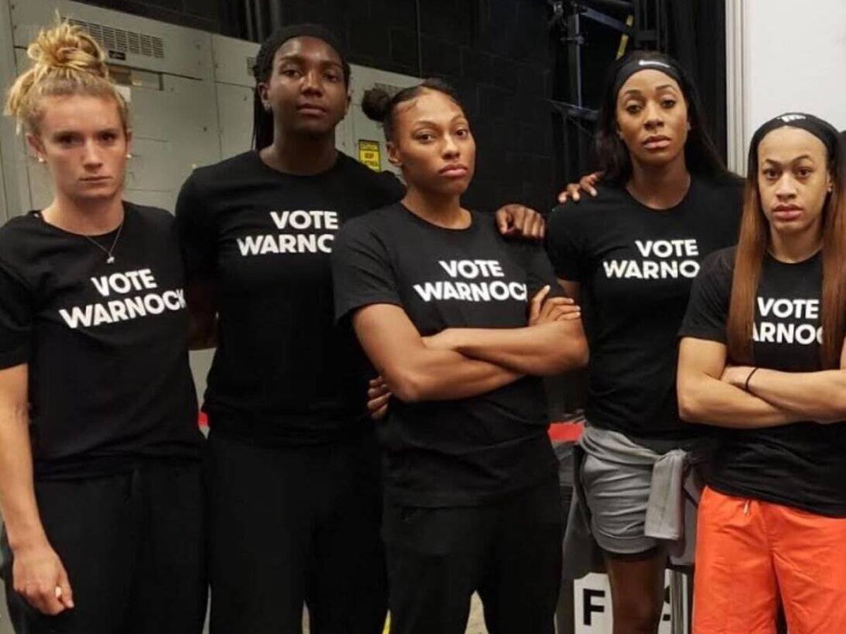 Photo: Atlanta Dream players wear shirts that support their owner's political rival.  (Elizabeth Williams)