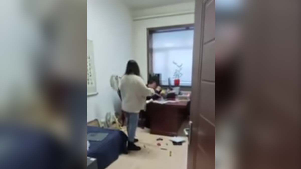Video: A woman hits her stalking boss with a mop