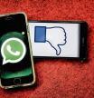 photo XAVIER CERVERA 10/05/2021 fall of whatsapp facebook and instagramm for about seven hours, the longest in history... symbolized by two mobile phones, whatsapp logo (iphone) and 'dislike' (thumb) of facebook (huawei) with red background as alarm d ( !)